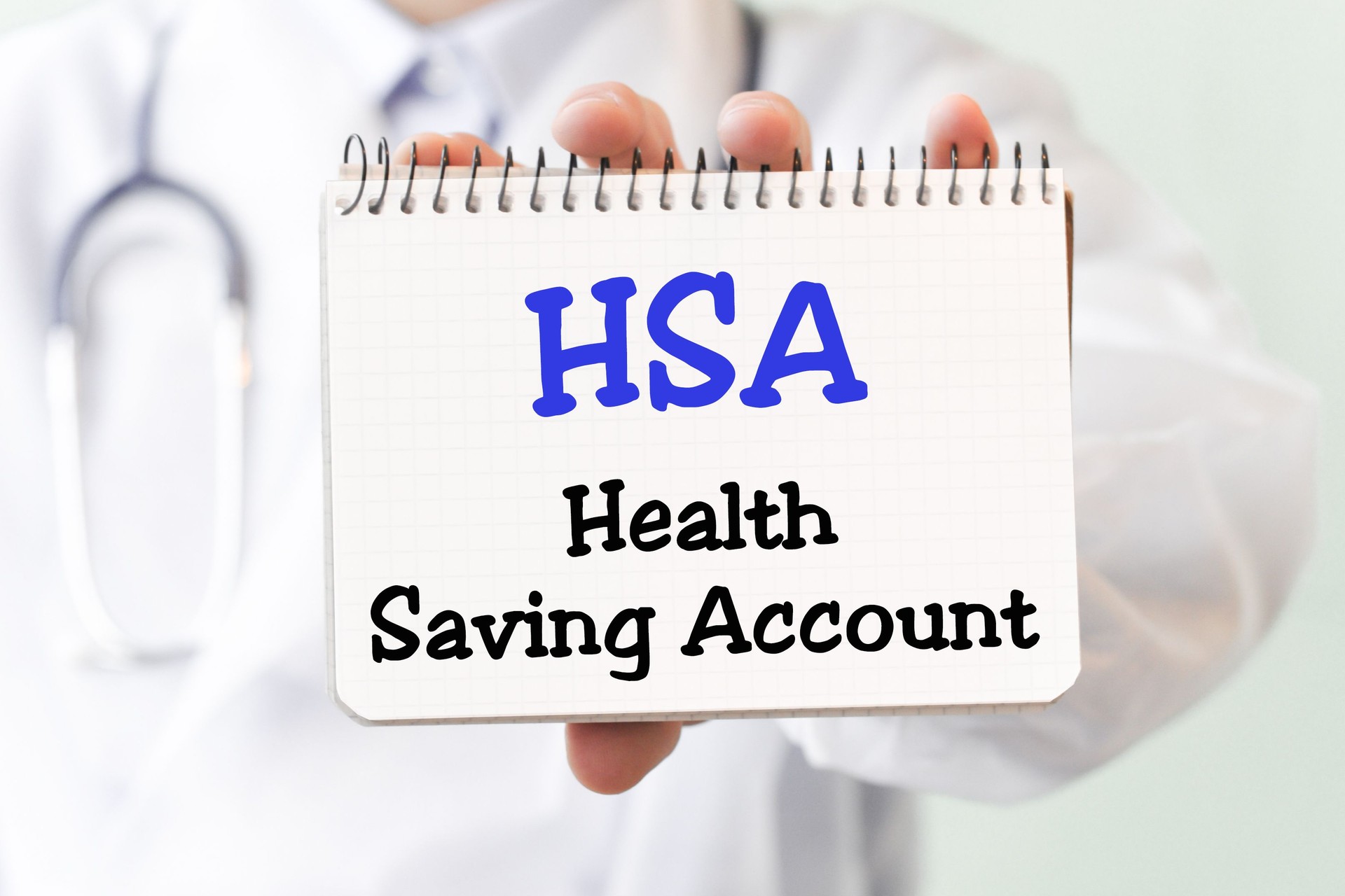 Doctor holding a card with text HSA Health Saving Account medical concept Doctor holding a card with text HSA Health Saving Account medical concept