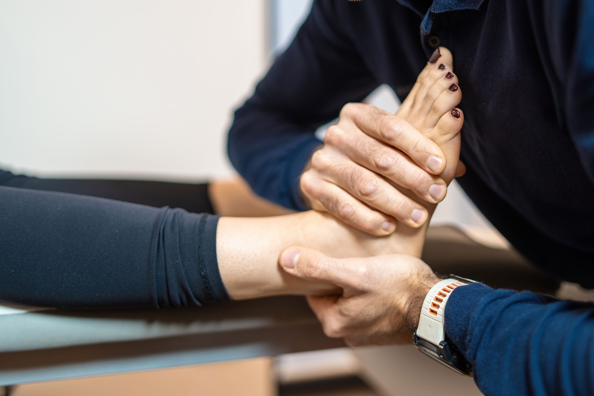 Physical Therapist Administering Foot and Ankle Treatment Physical Therapist Administering Foot and Ankle Treatment